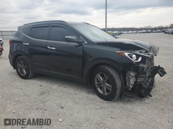 ✅ 2018 Hyundai Santa Fe 2.4L • VIN: 5XYZUDLB4JG563810 • Лот: 77243283. Опубликован ранее на Copart с пробегом 70 150 миль. Бесплатный доступ к архиву аукционных продаж из США и подробный отчёт об истории автомобиля на DreamBid. Изображение 4.