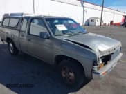 ✅ 1987 Nissan D21 • VIN: JN6HD16S1HW003646 • Lot: 43346425. Listed on IAAI with 194,433 mi. Free auction sales archive from the USA and detailed vehicle history report at DreamBid. Image 1.