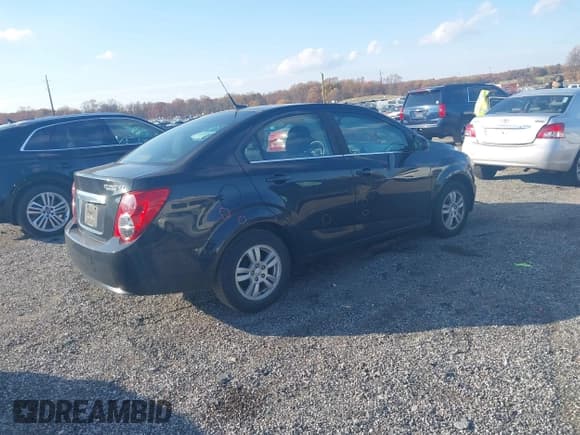 ✅ 2014 Chevrolet Sonic LT • VIN: 1G1JC5SH0E4228312 • Lot: 43579562. Listed on IAAI with 136,210 mi. Free auction sales archive from the USA and detailed vehicle history report at DreamBid. Image 4.