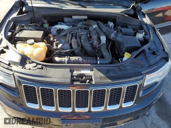 ✅ 2014 Jeep Grand Cherokee Overland • VIN: 1C4RJFCM1EC299459 • Lot: 90923835. Listed on Copart with 234,539 mi. Free auction sales archive from the USA and detailed vehicle history report at DreamBid. Image 12.