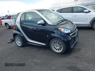 ✅ 2014 Smart fortwo Passion • VIN: WMEEJ9AA7EK733075 • Lot: 43138341. Listed on IAAI with 32,285 mi. Free auction sales archive from the USA and detailed vehicle history report at DreamBid. Image 1.