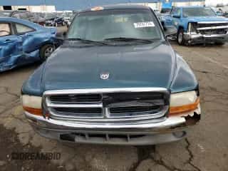 1999 Dodge Dakota SLT z VIN 1B7GG22Y5XS119136, wystawiony jako Copart lot #79797774 z przebiegiem 278 120 mil mil oraz Czysty tytuł • Clean title. Historia ofert i sprzedaży dostępna na DreamBid. Obrazek 5.