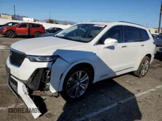 ✅ 2021 Cadillac XT6 Premium Luxury • VIN: 1GYKPCRS5MZ230218 • Lot: 91866815. Listed on Copart with 67,059 mi. Free auction sales archive from the USA and detailed vehicle history report at DreamBid. Image 1.