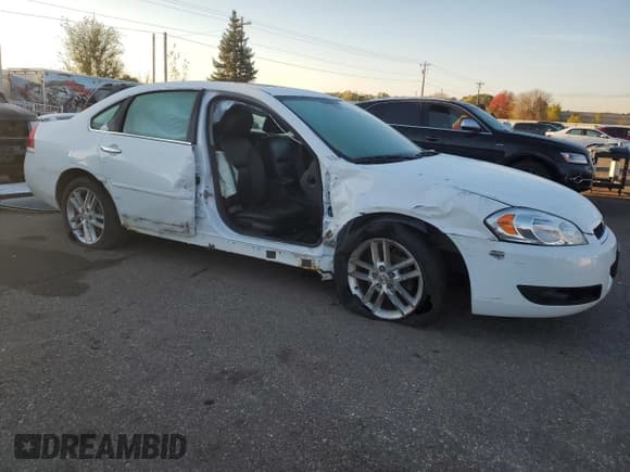 ✅ 2014 Chevrolet Impala LTZ • VIN: 2G1WC5E39E1152302 • Lot: 86253965. Listed on Copart with 121,662 mi. Free auction sales archive from the USA and detailed vehicle history report at DreamBid. Image 4.