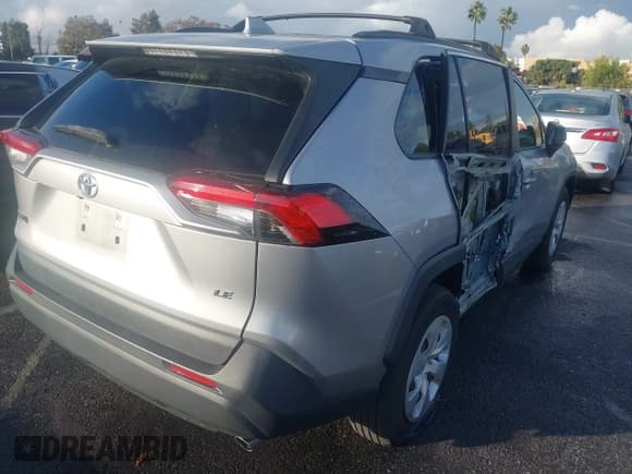 ✅ 2019 Toyota RAV4 LE • VIN: JTMH1RFV7KD015288 • Lot: 43763887. Listed on IAAI with 96,936 mi. Free auction sales archive from the USA and detailed vehicle history report at DreamBid. Image 4.