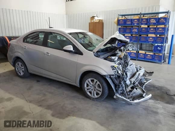 2017 Chevrolet Sonic LS с VIN 1G1JB5SH2H4123651, выставлен на аукционе Copart как лот 82694485 с пробегом Не указан миль и Списание • Salvage title. История ставок и продаж доступна на DreamBid. Изображение 4.