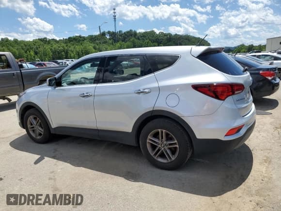 ✅ 2018 Hyundai Santa Fe 2.4L • VIN: 5XYZT3LB2JG565925 • Лот: 57539894. Опубликован ранее на Copart с пробегом 86 115 миль. Бесплатный доступ к архиву аукционных продаж из США и подробный отчёт об истории автомобиля на DreamBid. Изображение 2.