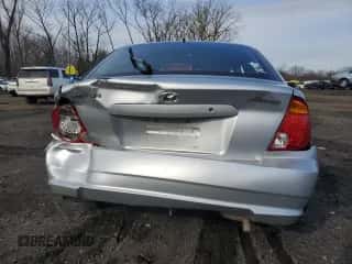 2005 Hyundai Accent GLS with VIN KMHCG35C05U343447, listed as a Copart auction lot 50418275 with 145,843 mi miles and Salvage title. Bid and sale history available at DreamBid. Image 6.