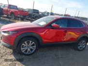 ✅ 2022 Mazda CX-30 S Premium • VIN: 3MVDMBDLXNM418896 • Lot: 43677405. Listed on IAAI with 29,689 mi. Free auction sales archive from the USA and detailed vehicle history report at DreamBid. Image 14.