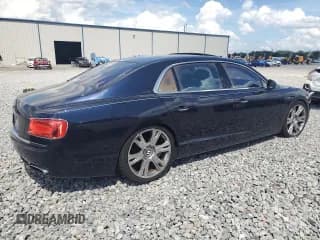 ✅ 2014 Bentley Flying Spur • VIN: SCBEC9ZA1EC094542 • Lot: 80836405. Wystawiony na Copart z przebiegiem 42 601 mil. Bezpłatny archiwum sprzedaży aukcyjnych z USA i szczegółowy raport historii pojazdu na DreamBid. Zdjęcie 3.