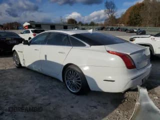 ✅ 2014 Jaguar XJ Portfolio • VIN: SAJWA2GZ0E8V60926 • Lot: 91886025. Listed on Copart with 76,911 mi. Free auction sales archive from the USA and detailed vehicle history report at DreamBid. Image 2.