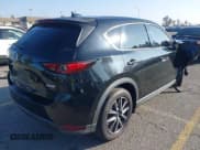 ✅ 2017 Mazda CX-5 Grand Touring • VIN: JM3KFADL2H0148560 • Lot: 43633384. Listed on IAAI with 136,091 mi. Free auction sales archive from the USA and detailed vehicle history report at DreamBid. Image 4.