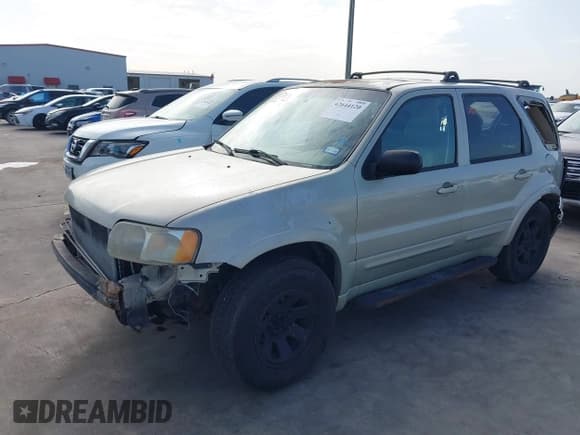 ✅ 2003 Ford Escape Limited • VIN: 1FMCU94103KD47888 • Lot: 42644120. Listed on IAAI with 247,024 mi. Free auction sales archive from the USA and detailed vehicle history report at DreamBid. Image 2.