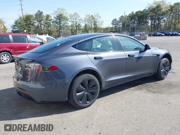 ✅ 2021 Tesla Model S Plaid • VIN: 5YJSA1E66MF456357 • Lot: 42130286. Listed on IAAI with 48,010 mi. Free auction sales archive from the USA and detailed vehicle history report at DreamBid. Image 4.