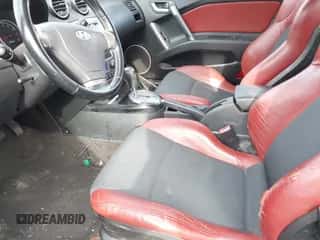 ✅ 2008 Hyundai Tiburon GT • VIN: KMHHN66FX8U268394 • Лот: 43293640. Опубликован ранее на IAAI с пробегом 66 751 миль. Бесплатный доступ к архиву аукционных продаж из США и подробный отчёт об истории автомобиля на DreamBid. Изображение 5.