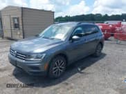 ✅ 2021 Volkswagen Tiguan S • VIN: 3VV1B7AX5MM148491 • Lot: 42561437. Listed on IAAI with 54,084 mi. Free auction sales archive from the USA and detailed vehicle history report at DreamBid. Image 2.
