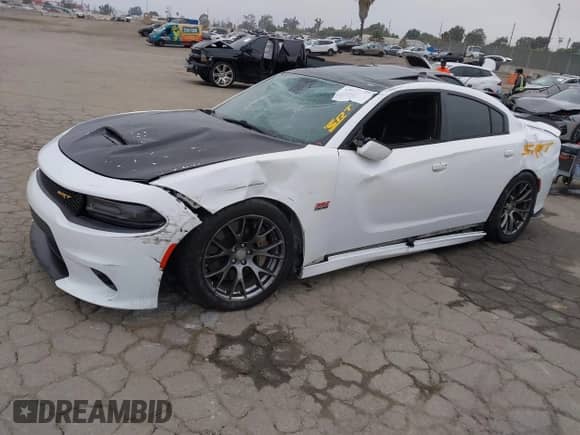 2016 Dodge Charger SRT 392 with VIN 2C3CDXEJ1GH347827, listed as a IAAI auction lot 43011873 with 128,926 mi miles and . Bid and sale history available at DreamBid. Image 2.