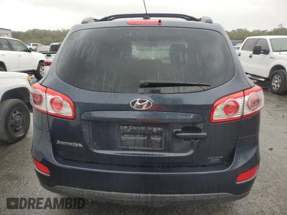 ✅ 2012 Hyundai Santa Fe GLS • VIN: 5XYZG3AB7CG124818 • Lot: 79463594. Listed on Copart with 186,656 mi. Free auction sales archive from the USA and detailed vehicle history report at DreamBid. Image 6.