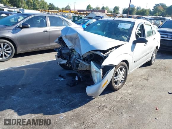 ✅ 2003 Ford Focus LX • VIN: 1FAFP33P43W334166 • Lot: 43258133. Listed on IAAI with Not provided. Free auction sales archive from the USA and detailed vehicle history report at DreamBid. Image 2.