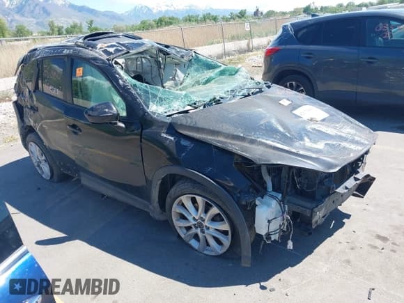 ✅ 2014 Mazda CX-5 Grand Touring • VIN: JM3KE2DY5E0328938 • Lot: 42170496. Wystawiony na IAAI z przebiegiem Nie podano. Bezpłatny archiwum sprzedaży aukcyjnych z USA i szczegółowy raport historii pojazdu na DreamBid. Zdjęcie 1.