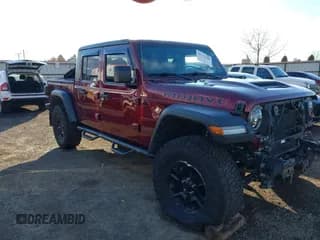 ✅ 2021 Jeep Gladiator Mojave • VIN: 1C6JJTEG8ML607297 • Lot: 43772700. Listed on IAAI with 32,447 mi. Free auction sales archive from the USA and detailed vehicle history report at DreamBid. Image 1.