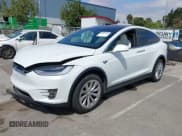 ✅ 2021 Tesla Model X Long Range Plus • VIN: 5YJXCDE27MF322200 • Lot: 42360282. Listed on IAAI with 37,072 mi. Free auction sales archive from the USA and detailed vehicle history report at DreamBid. Image 2.
