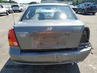 2003 Hyundai Accent GL z VIN KMHCG45C63U476751, wystawiony jako Copart lot #66774675 z przebiegiem 113 600 mil mil oraz Szkoda całkowita • Salvage title. Historia ofert i sprzedaży dostępna na DreamBid. Obrazek 6.