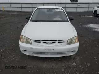 2002 Hyundai Accent with VIN KMHCF35G52U207137, listed as a Copart auction lot 82818574 with 185,177 mi miles and Salvage title. Bid and sale history available at DreamBid. Image 5.