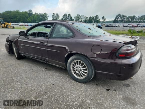 ✅ 2002 Pontiac Grand Prix GT • VIN: 1G2WP12K62F267108 • Lot: 64470845. Listed on Copart with 112,997 mi. Free auction sales archive from the USA and detailed vehicle history report at DreamBid. Image 2.