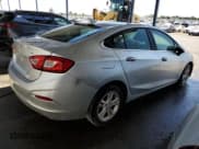✅ 2018 Chevrolet Cruze LT • VIN: 1G1BE5SM8J7189487 • Lot: 62569483. Listed on Copart with 126,588 mi. Free auction sales archive from the USA and detailed vehicle history report at DreamBid. Image 3.
