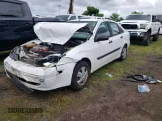 ✅ 2004 Ford Focus LX • VIN: 1FAFP33P74W164340 • Lot: 70513195. Wystawiony na Copart z przebiegiem 186 485 mil. Bezpłatny archiwum sprzedaży aukcyjnych z USA i szczegółowy raport historii pojazdu na DreamBid. Zdjęcie 1.