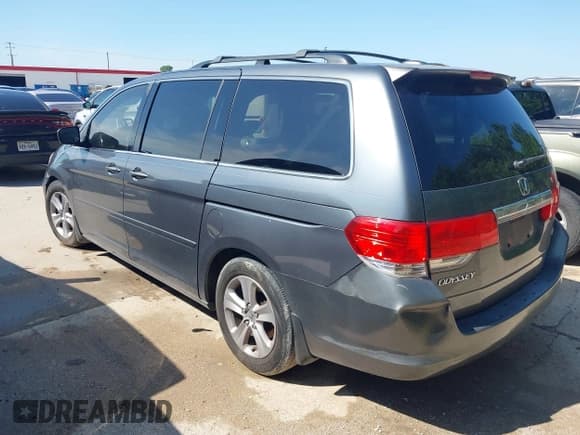 ✅ 2010 Honda Odyssey Touring • VIN: 5FNRL3H90AB057238 • Lot: 42496055. Listed on IAAI with 183,465 mi. Free auction sales archive from the USA and detailed vehicle history report at DreamBid. Image 3.