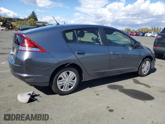 ✅ 2014 Honda Insight • VIN: JHMZE2H3XES000889 • Lot: 84641315. Listed on Copart with 84,590 mi. Free auction sales archive from the USA and detailed vehicle history report at DreamBid. Image 3.