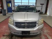 ✅ 2010 Dodge Caliber Mainstreet • VIN: 1B3CB3HA0AD599676 • Лот: 89916905. Опубликован ранее на Copart с пробегом 88 102 миль. Бесплатный доступ к архиву аукционных продаж из США и подробный отчёт об истории автомобиля на DreamBid. Изображение 5.