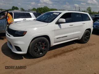 ✅ 2018 Jeep Grand Cherokee • VIN: NJ1449E • Lot: 51357834. Listed on Copart with 32,619 mi. Free auction sales archive from the USA and detailed vehicle history report at DreamBid. Image 1.