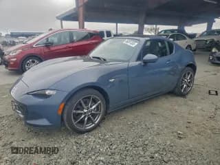 ✅ 2021 Mazda MX-5 Miata Grand Touring • VIN: JM1NDAM75M0461451 • Lot: 96091305. Listed on Copart with 23,474 mi. Free auction sales archive from the USA and detailed vehicle history report at DreamBid. Image 1.