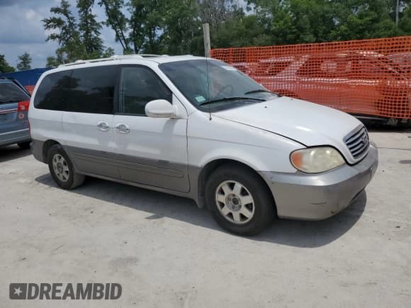 ✅ 2002 Kia Sedona LX • VIN: KNDUP131826116599 • Lot: 55833865. Listed on Copart with 156,961 mi. Free auction sales archive from the USA and detailed vehicle history report at DreamBid. Image 4.