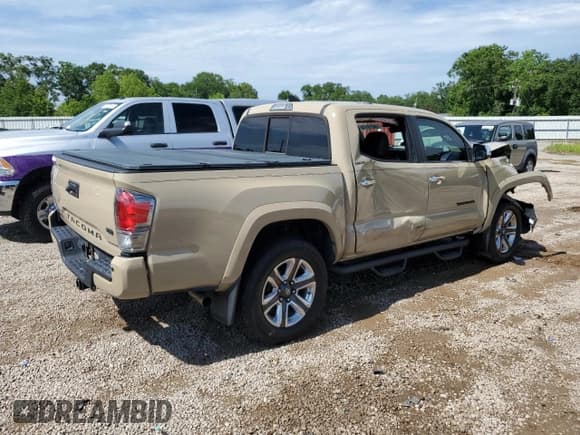 ✅ 2016 Toyota Tacoma Limited • VIN: 5TFEZ5CN2GX017609 • Lot: 58219115. Listed on Copart with 97,034 mi. Free auction sales archive from the USA and detailed vehicle history report at DreamBid. Image 3.