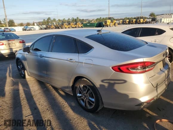 ✅ 2018 Ford Fusion SE • VIN: 3FA6P0H76JR194676 • Лот: 90403935. Опубликован ранее на Copart с пробегом 148 757 миль. Бесплатный доступ к архиву аукционных продаж из США и подробный отчёт об истории автомобиля на DreamBid. Изображение 2.