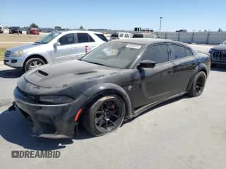 ✅ 2021 Dodge Charger SRT Hellcat Redeye Widebody • VIN: 2C3CDXL96MH580848 • Lot: 69320035. Wystawiony na Copart z przebiegiem 28 784 mil. Bezpłatny archiwum sprzedaży aukcyjnych z USA i szczegółowy raport historii pojazdu na DreamBid. Zdjęcie 1.