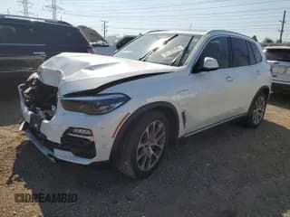 ✅ 2021 BMW X5 xDrive45e • VIN: 5UXTA6C00M9F27743 • Лот: 80132945. Опубликован ранее на Copart с пробегом Не указан. Бесплатный доступ к архиву аукционных продаж из США и подробный отчёт об истории автомобиля на DreamBid. Изображение 1.