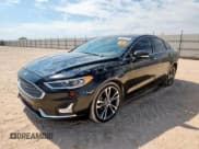 ✅ 2020 Ford Fusion Titanium • VIN: 3FA6P0D92LR193986 • Lot: 85556775. Wystawiony na Copart z przebiegiem 147 306 mil. Bezpłatny archiwum sprzedaży aukcyjnych z USA i szczegółowy raport historii pojazdu na DreamBid. Zdjęcie 1.