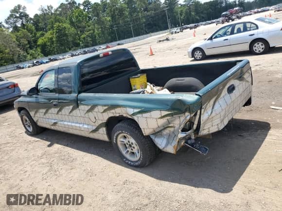 1999 Dodge Dakota SLT z VIN 1B7GL22X0XS145128, wystawiony jako Copart lot #64959364 z przebiegiem 96 047 mil mil oraz Szkoda całkowita • Salvage title. Historia ofert i sprzedaży dostępna na DreamBid. Obrazek 2.