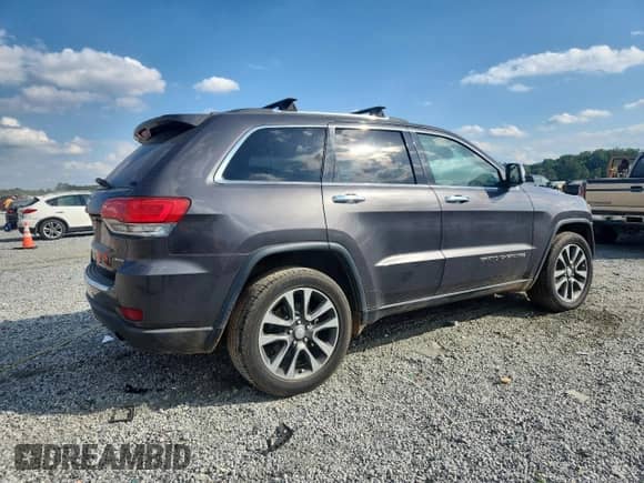 2018 Jeep Grand Cherokee Limited с VIN 1C4RJEBG2JC113704, выставлен на аукционе Copart как лот 71190225 с пробегом 79 918 миль миль и Списание • Salvage title. История ставок и продаж доступна на DreamBid. Изображение 3.