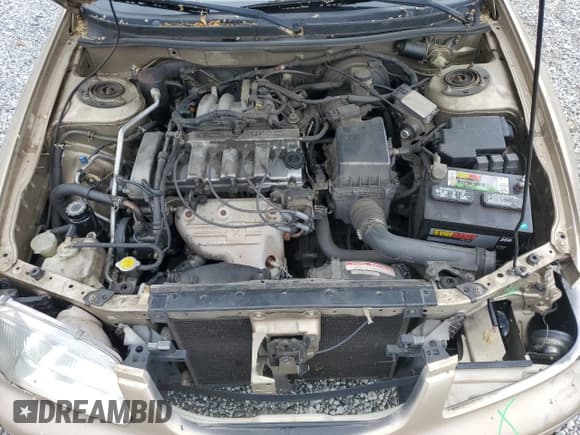 ✅ 2001 Mazda 626 LX • VIN: 1YVGF22C715202574 • Лот: 54132915. Опубликован ранее на Copart с пробегом 237 041 миль. Бесплатный доступ к архиву аукционных продаж из США и подробный отчёт об истории автомобиля на DreamBid. Изображение 11.