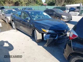 ✅ 2020 Toyota Camry Hybrid XLE • VIN: 4T1F31AK7LU521801 • Lot: 43504243. Listed on IAAI with 66,573 mi. Free auction sales archive from the USA and detailed vehicle history report at DreamBid. Image 1.