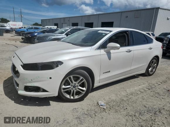 ✅ 2016 Ford Fusion Titanium Hybrid • VIN: 3FA6P0RU9GR191025 • Lot: 66987695. Wystawiony na Copart z przebiegiem 161 893 mil. Bezpłatny archiwum sprzedaży aukcyjnych z USA i szczegółowy raport historii pojazdu na DreamBid. Zdjęcie 1.