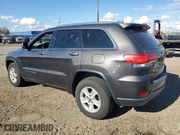 ✅ 2015 Jeep Grand Cherokee Laredo • VIN: 1C4RJFAG4FC793992 • Lot: 87296455. Listed on Copart with 234,821 mi. Free auction sales archive from the USA and detailed vehicle history report at DreamBid. Image 2.