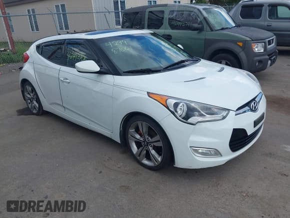 ✅ 2012 Hyundai Veloster w/Gray Int • VIN: KMHTC6AD8CU048797 • Lot: 42998706. Wystawiony na IAAI z przebiegiem 130 045 mil. Bezpłatny archiwum sprzedaży aukcyjnych z USA i szczegółowy raport historii pojazdu na DreamBid. Zdjęcie 1.