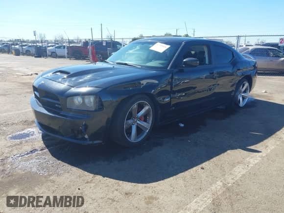 2009 Dodge Charger SRT-8 с VIN 2B3LA73WX9H560878, выставлен на аукционе IAAI как лот 41751921 с пробегом 138 596 миль миль и . История ставок и продаж доступна на DreamBid. Изображение 2.